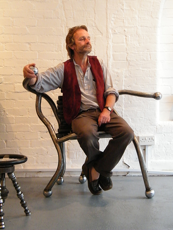 Artist Neil Warmsley tries out the Boule Chair