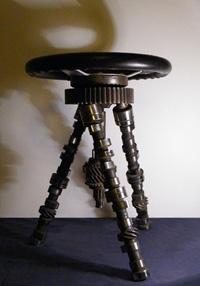 Modern welded metal furniture - created from car parts including mini camshafts and steering wheel