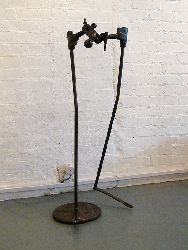 Body Sculpture - metal sculpture constructed from found objects from a plough, car parts and a weight