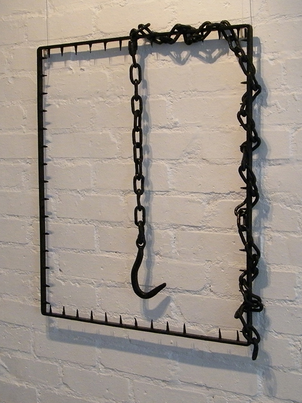 Hooked - Metal wall sculpture created from found objects