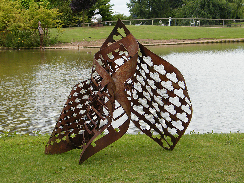 Trinity is metal sculpture created from cnc punched then hand-rolled steel
