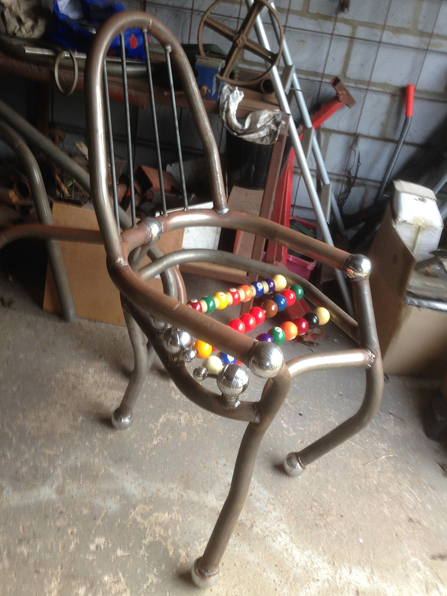 Steel chair in sculpture workshop