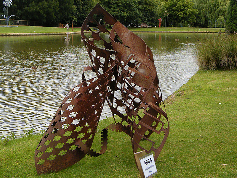 Family is metal sculpture created from cnc punched then hand-rolled steel